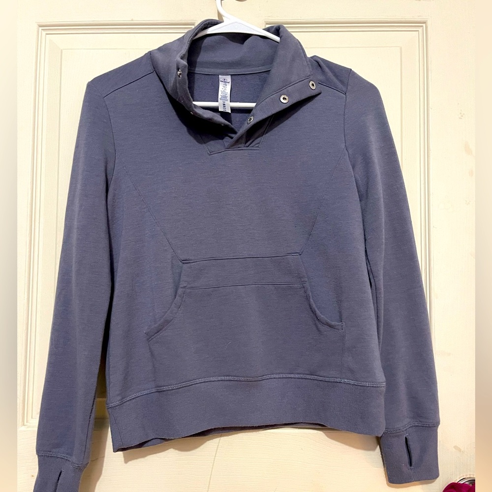 Girls size large blue long sleeve pullover, 90 degree.